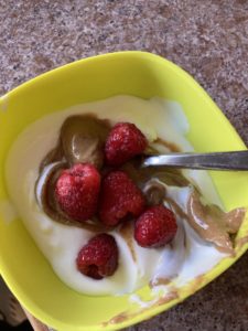 Feeding baby - Yogurt, almond butter and raspberries