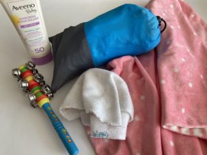 Toy, sunscreen, wash cloth, blanket & waterproof picnic blanket
