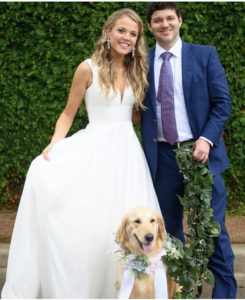 Molly and Justin on their wedding day with their dog, Brooklyn