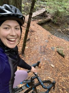Caitlin on her cyclocross bike riding through some Squamish trails